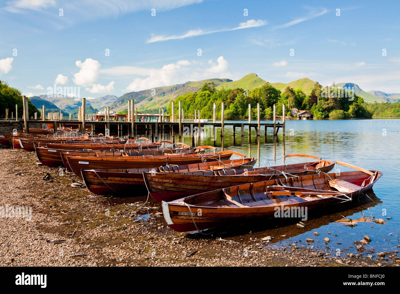 Rowing boats for hire moored along the shore of Derwentwater,at Keswick in the Lake District National Park, Cumbria, England, UK Stock Photo