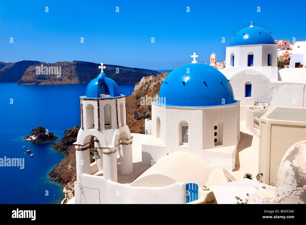 Typical traditional blue domed church of Oia, Santorini ( Thira ) Island Greece Stock Photo