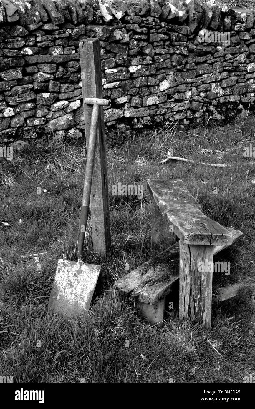 Black and white image of a spade and old stile. Stock Photo