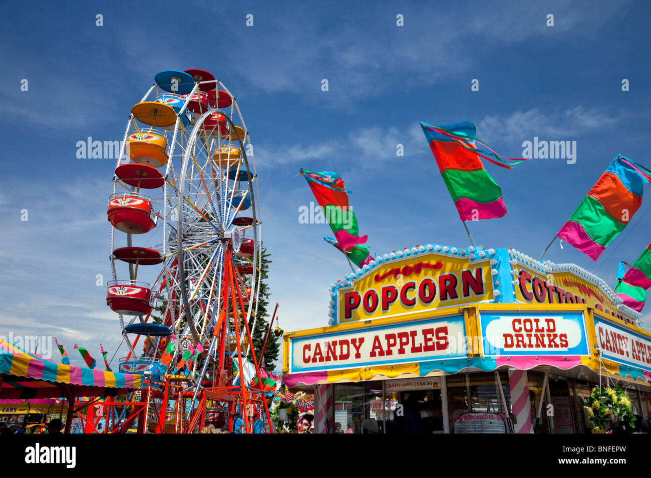 The color of the Wonder Shows midway with ferris wheel at the Carmen Fair. Stock Photo