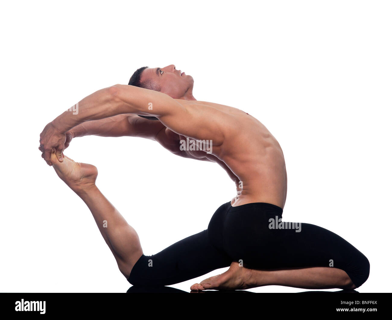 Man yoga Eka Pada Rajakapotasana pose One-Legged King Pigeon stretch gymnastic acrobatics  studio on white background Stock Photo