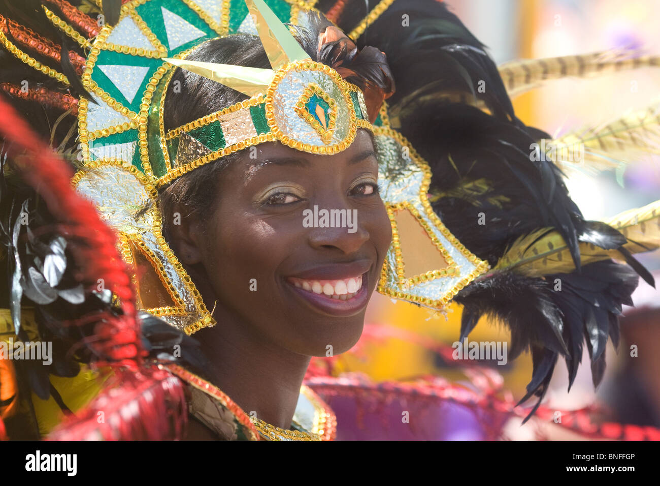 Woman wearing a colourful costume at St Paul's carnival Bristol Stock Photo