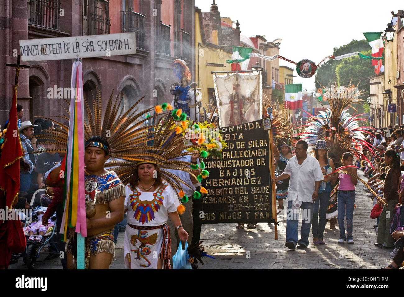 Feathered costumed participants in the annual INDEPENDENCE DAY PARADE held on September 16th  - SAN MIGUEL DE ALLENDE, MEXICO Stock Photo