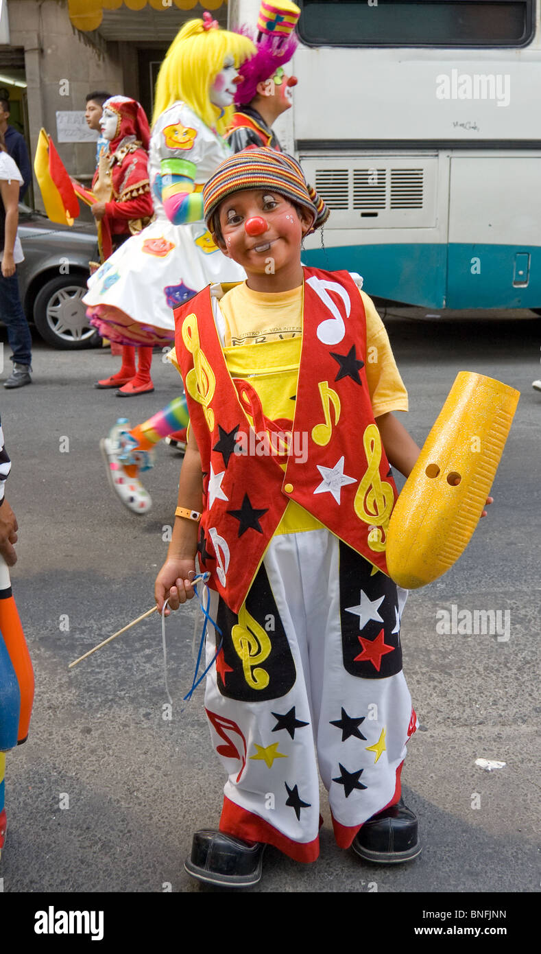 Kid clown during a clown parade in Mexico city with clowns from several countries Stock Photo