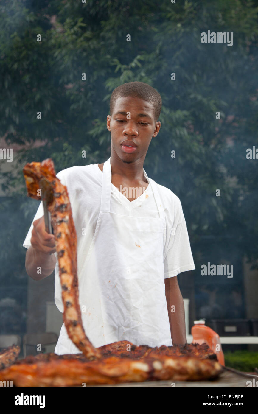Detroit, Michigan A restaurant employee grills meat for sale during a