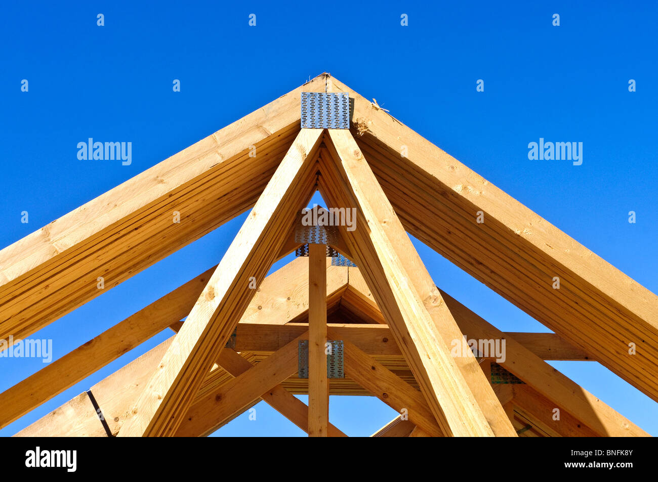 Prefabricated timber roof trusses for new domestic housing construction - Indre-et-Loire, France. Stock Photo