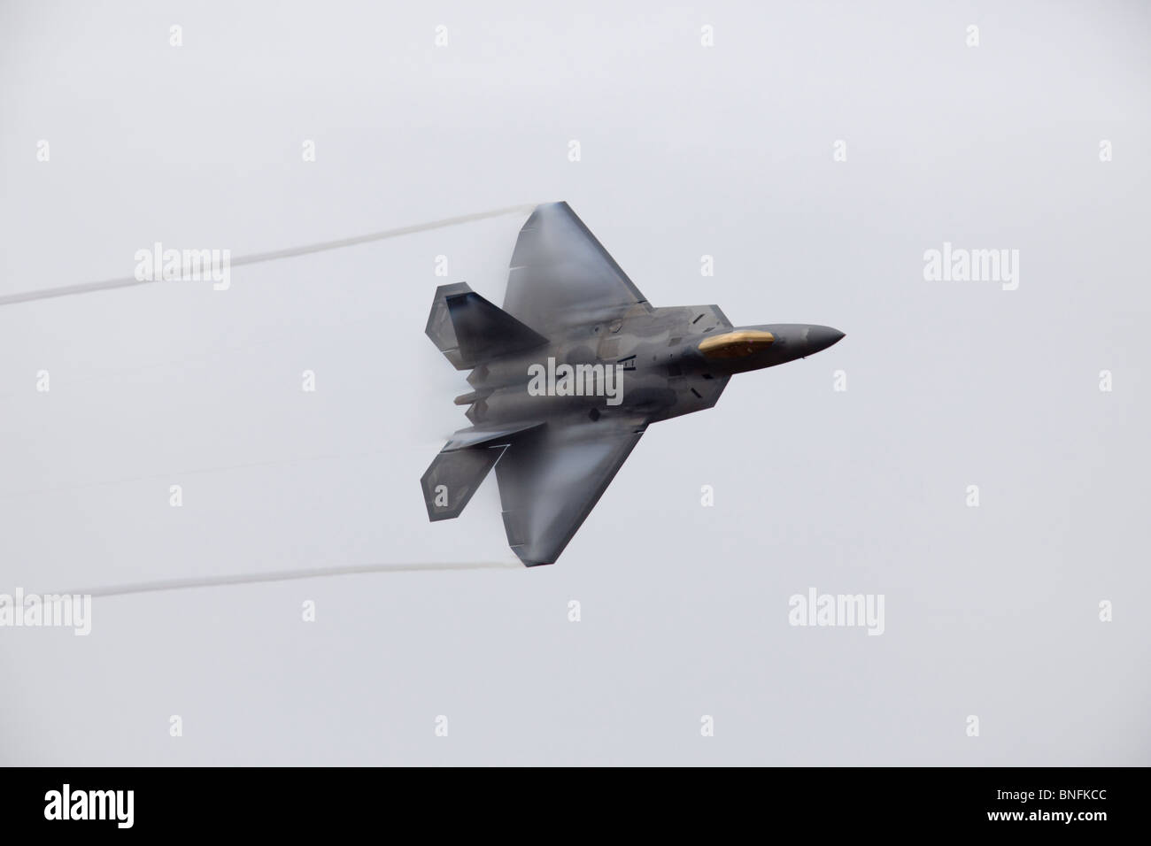 F22 Raptor with contrails Stock Photo