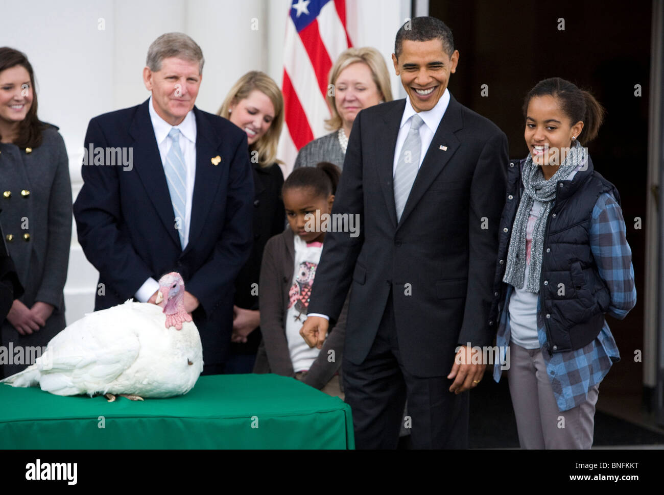 President Barrack Obama and daughters Sasha and Malia pardon the National Thanksgiving Turkey.  Stock Photo