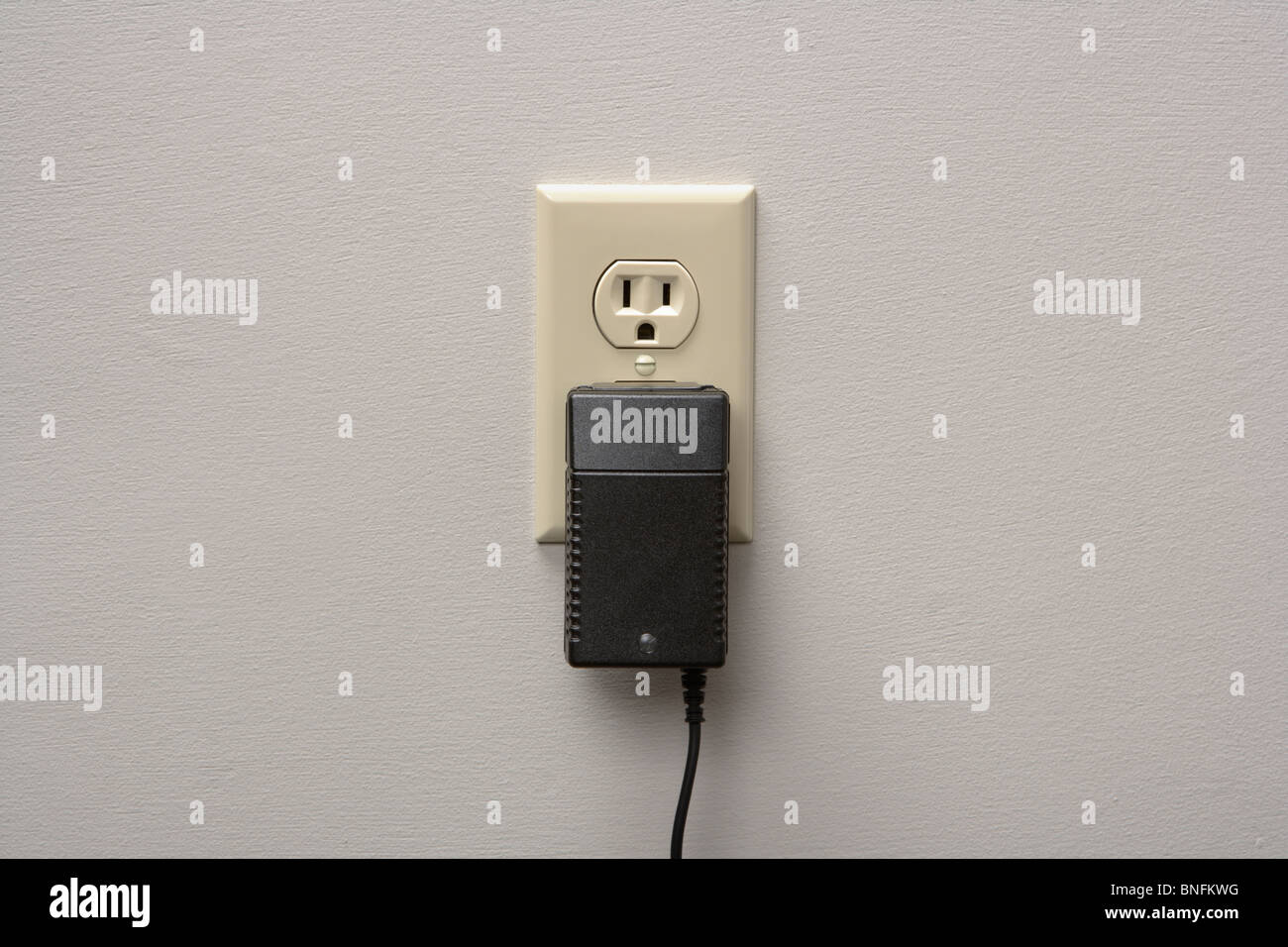 Wall Charger Plugged into Outlet Stock Photo Alamy