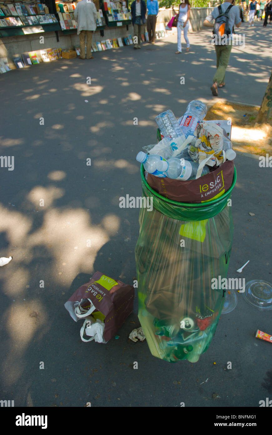Overflowing bin garbage can St-Germain-des-Pres Paris France Europe Stock Photo