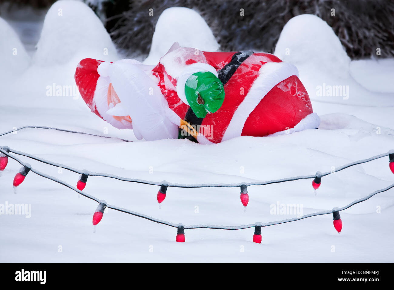Santa fallen down in snow storm. Stock Photo