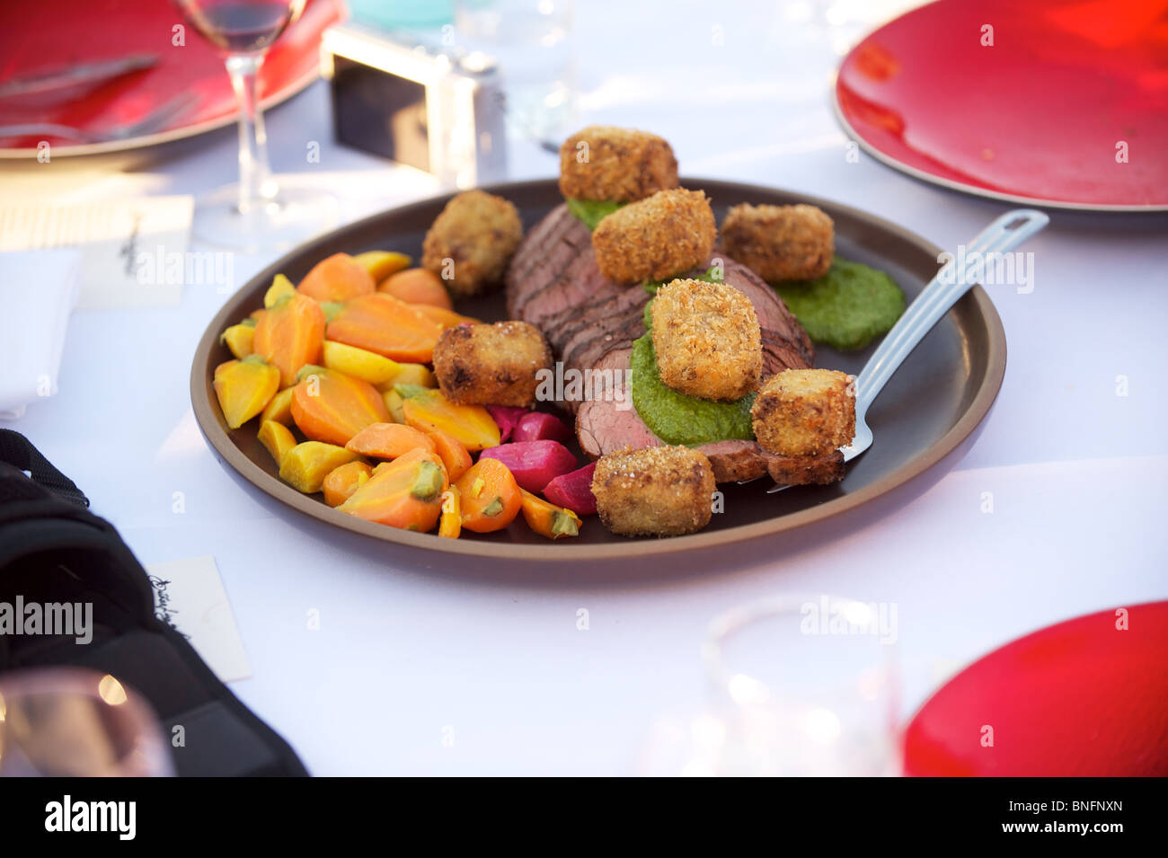 Grilled beef tenderloin, sautéed beets and carrots. Outstanding in the Field Dinner. Pemberton