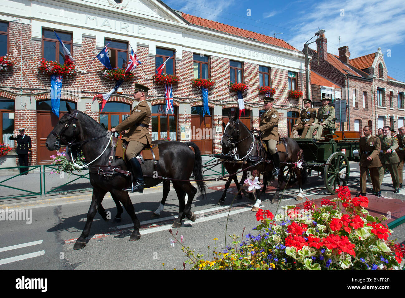 A horse drawn carriage carries the last WW1 soldier to be buried at the new British War Graves Commission cemetery at Fromelles Stock Photo