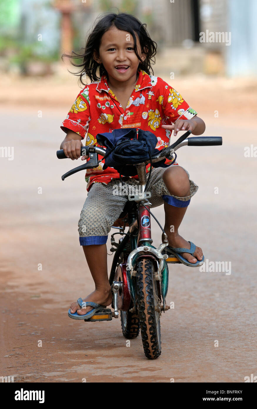 little girl on bicycle