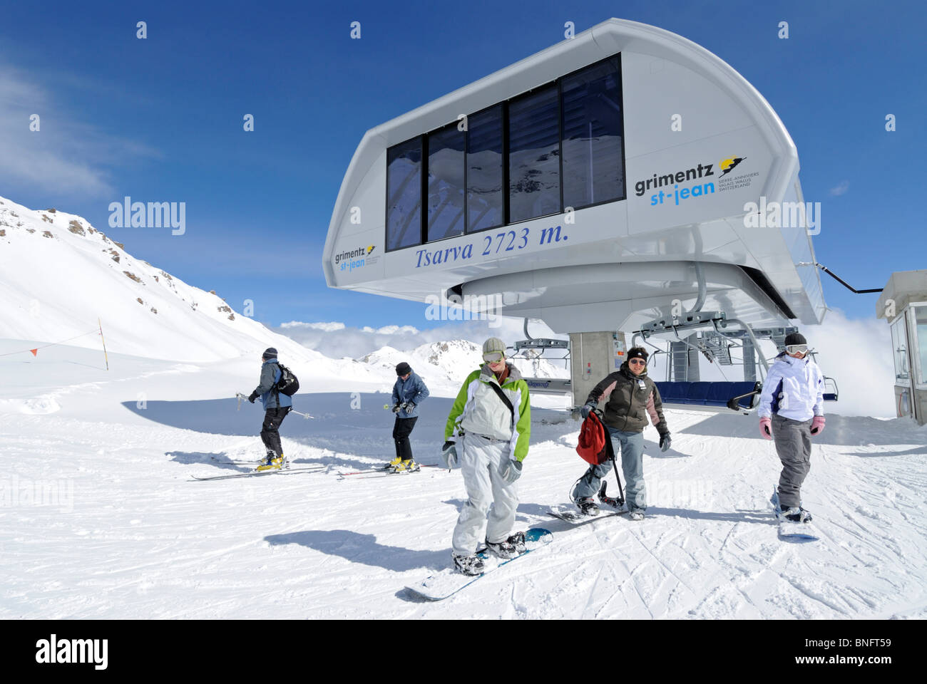 Skiers leaving gondola at Tsarva in Grimentz, Valais, Switzerland, Europe Stock Photo