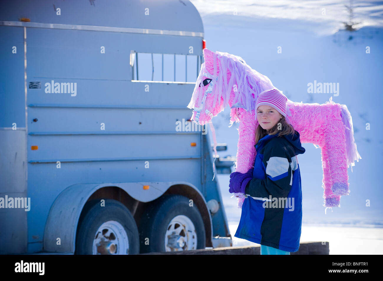Girl carrying a pink pony pinata, Bozeman, Montana, USA Stock Photo Alamy