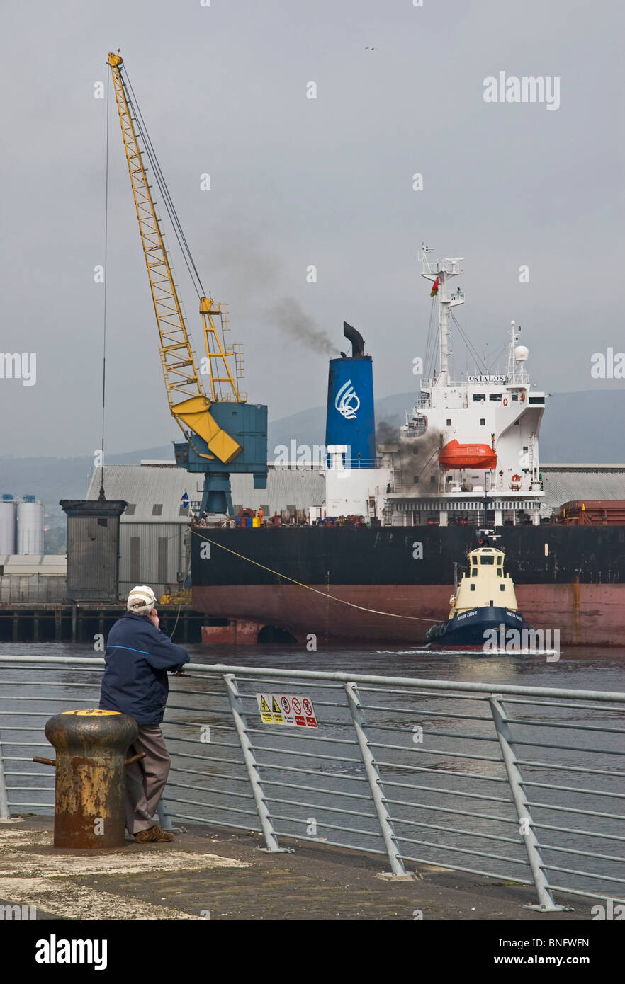 Tug Norton Cross assisting bulk carrier, Okialos, Belfast docks Stock Photo Alamy
