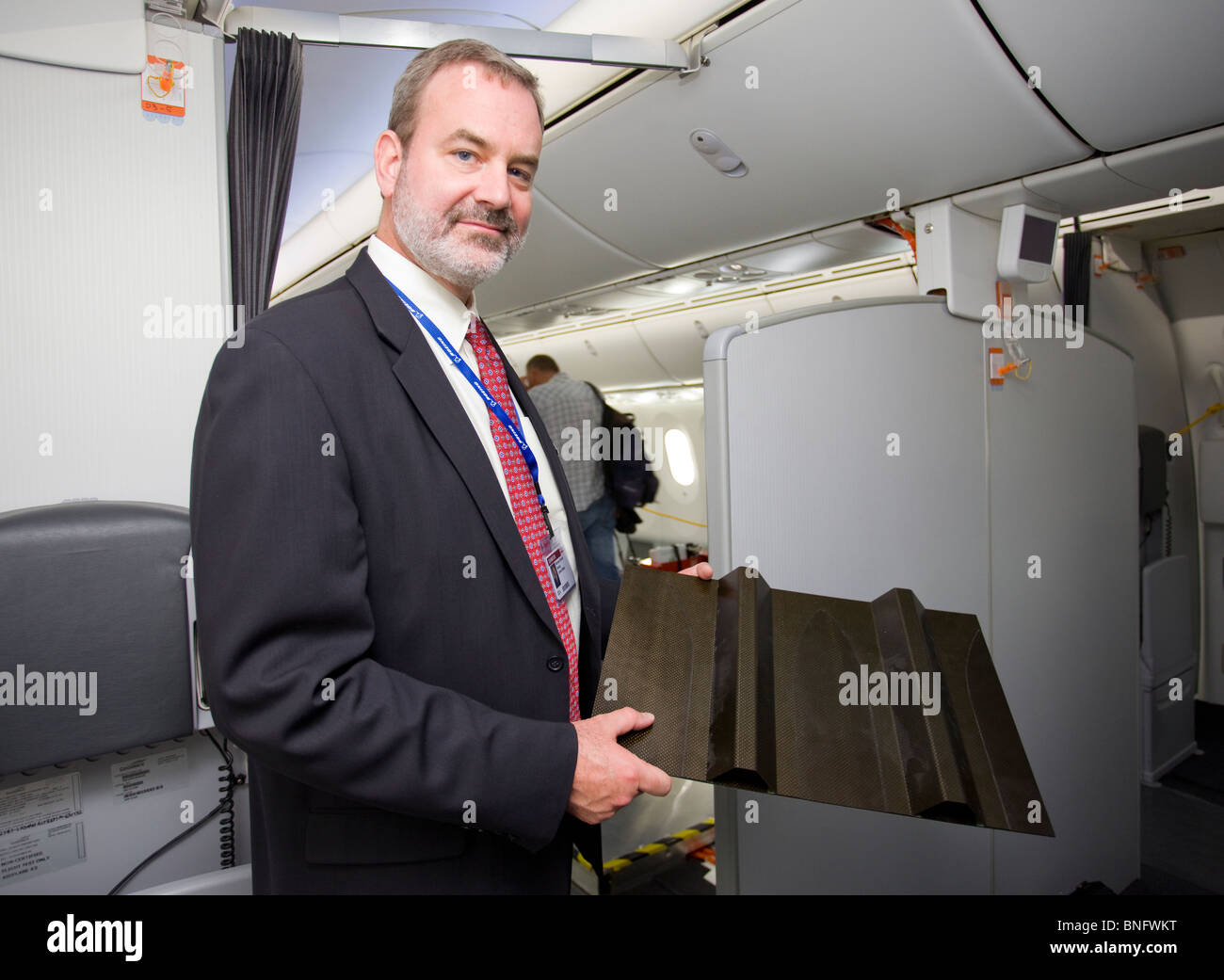 Boeing 787 dreamliner engineer with a sample of the composite material which makes up the aircrafts skin Stock Photo