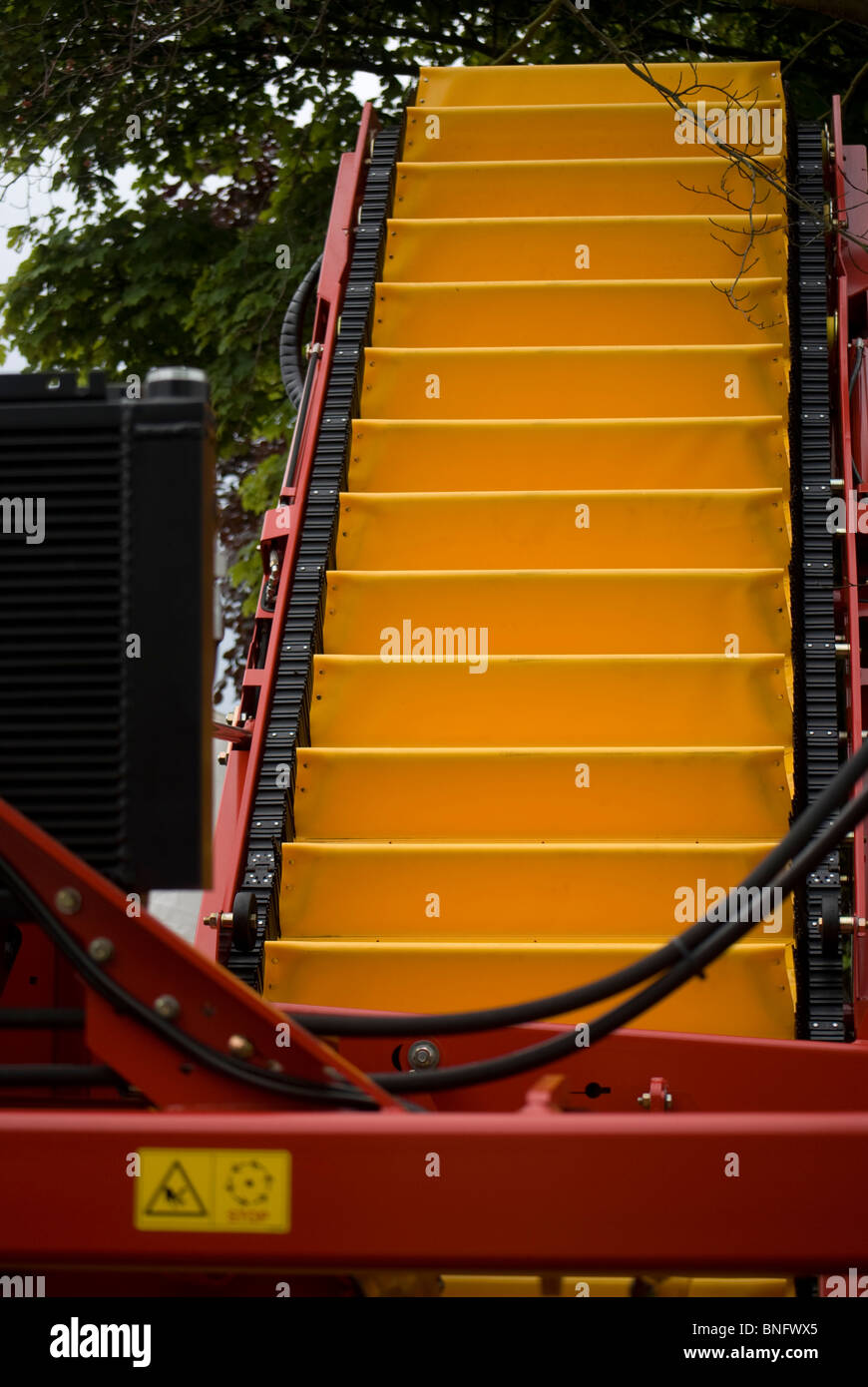 Conveyor belt on a potato harvester Stock Photo Alamy