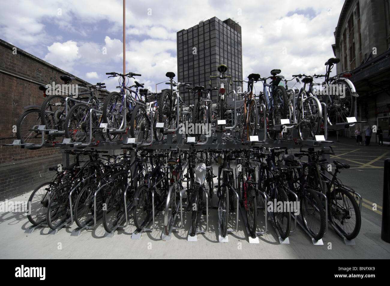 Bicycles staocked in parking racks at Waterloo Station London England