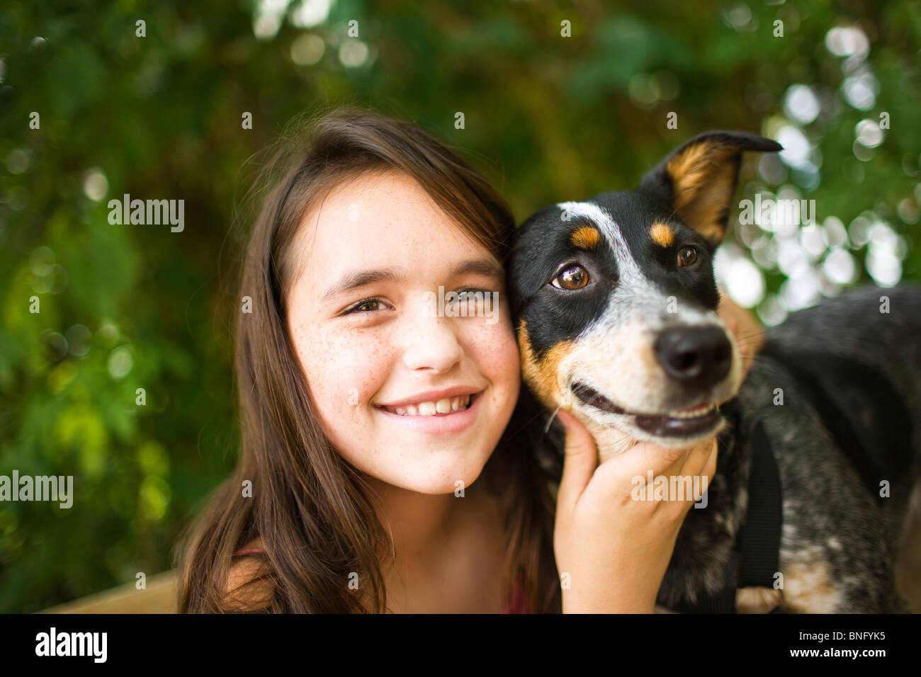 Close-up of a teenage girl with a dog Stock Photo - Alamy