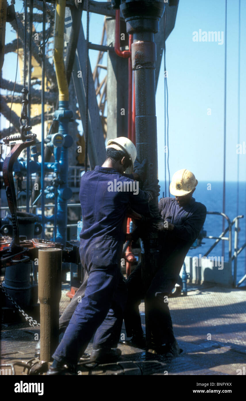 Changing an oil drill on an off-shore platform in the Arabian Gulf 1975 Stock Photo