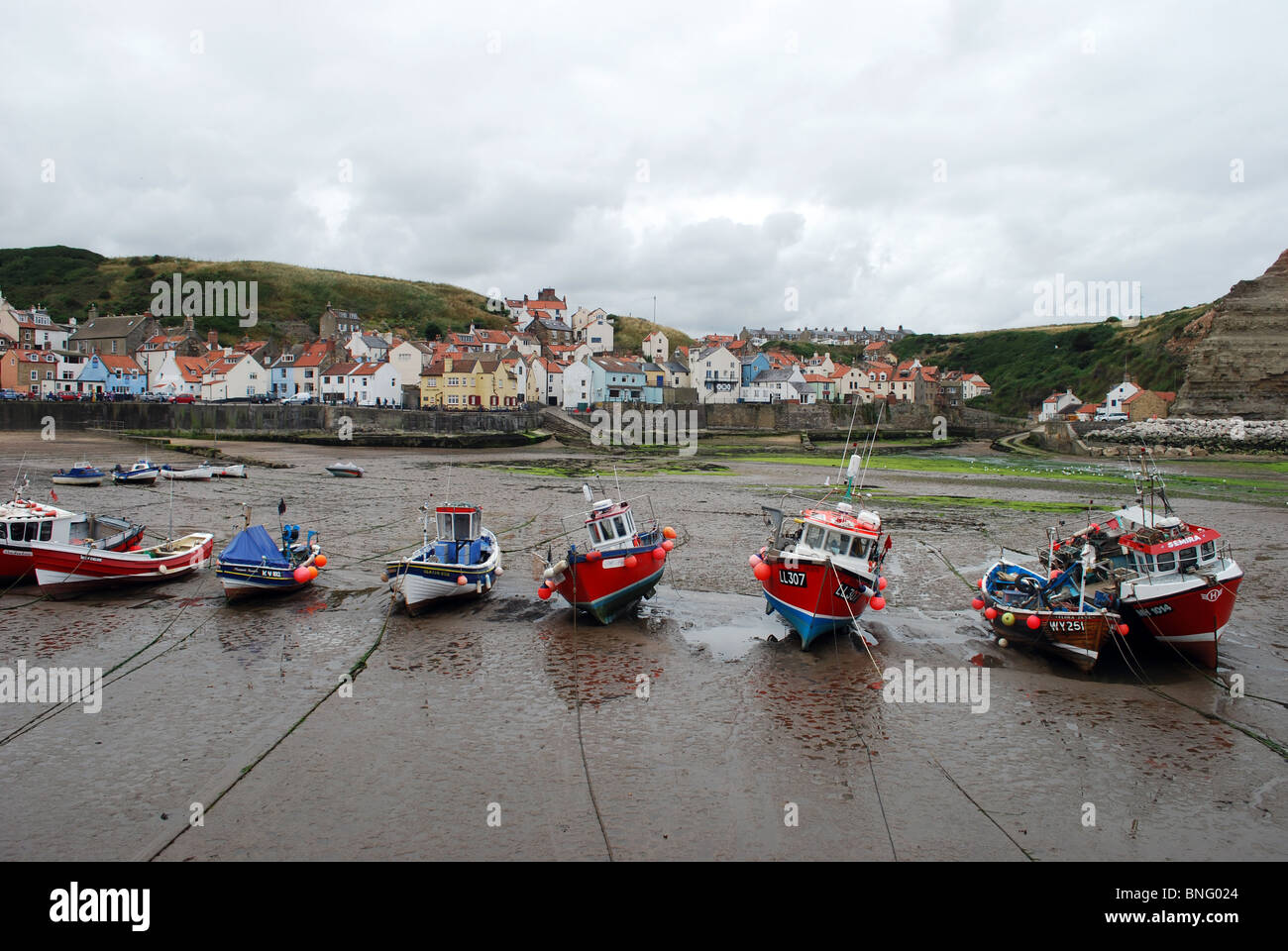 Fishing boats in Staithes Harbour Stock Photo - Alamy