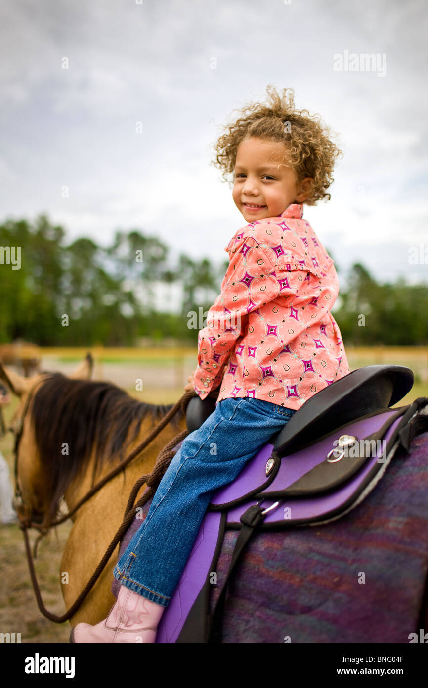 Girl riding a horse Stock Photo - Alamy