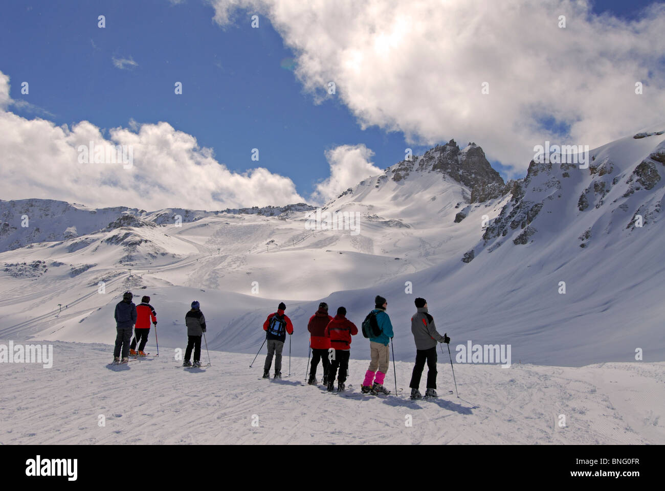 Skiers overlooking the ski slopes of Grimentz, Swiss Alps, Switzerland, Europe Stock Photo
