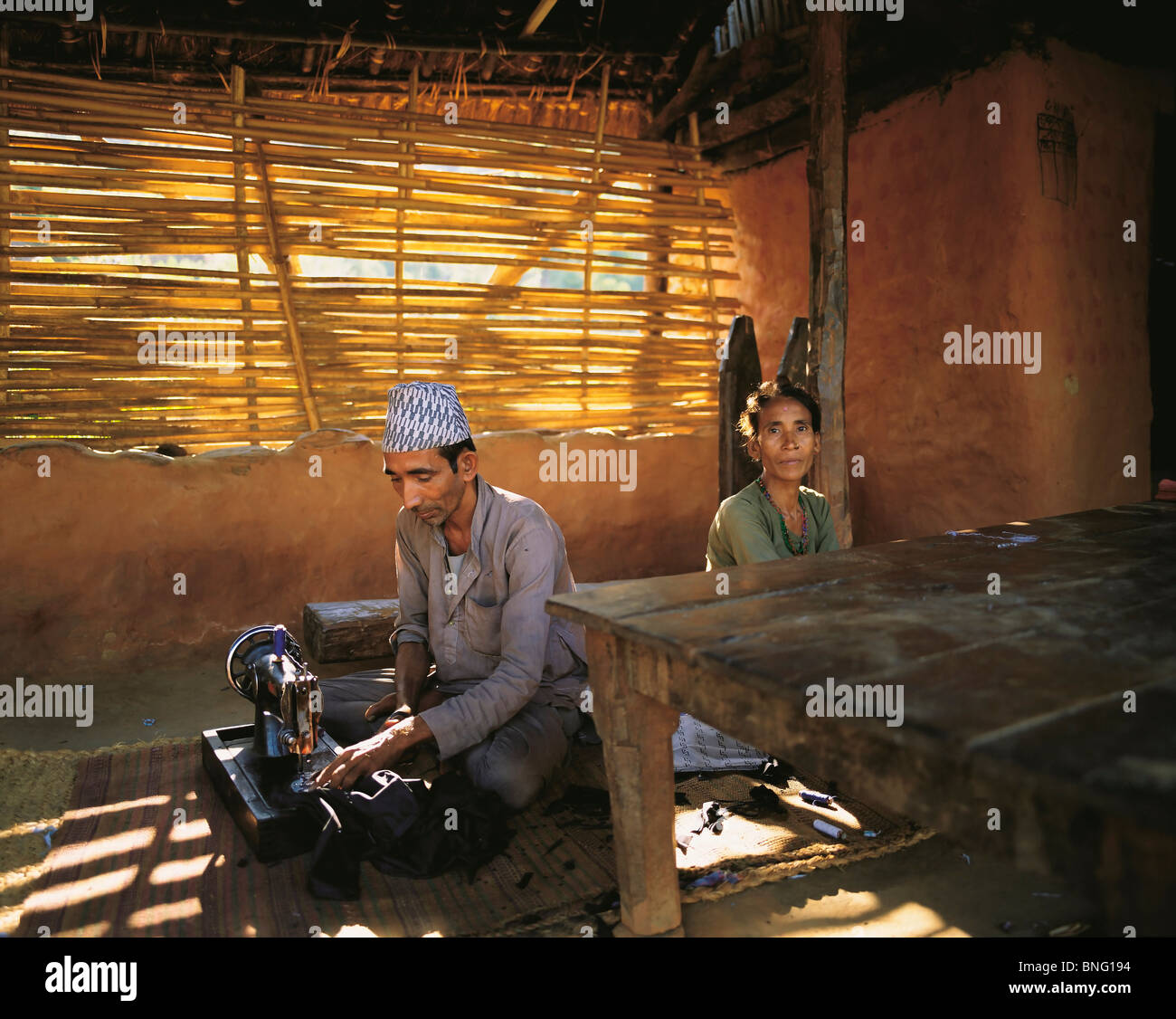 The village tailor and his wife in the village of Sultibari in east Nepal Stock Photo