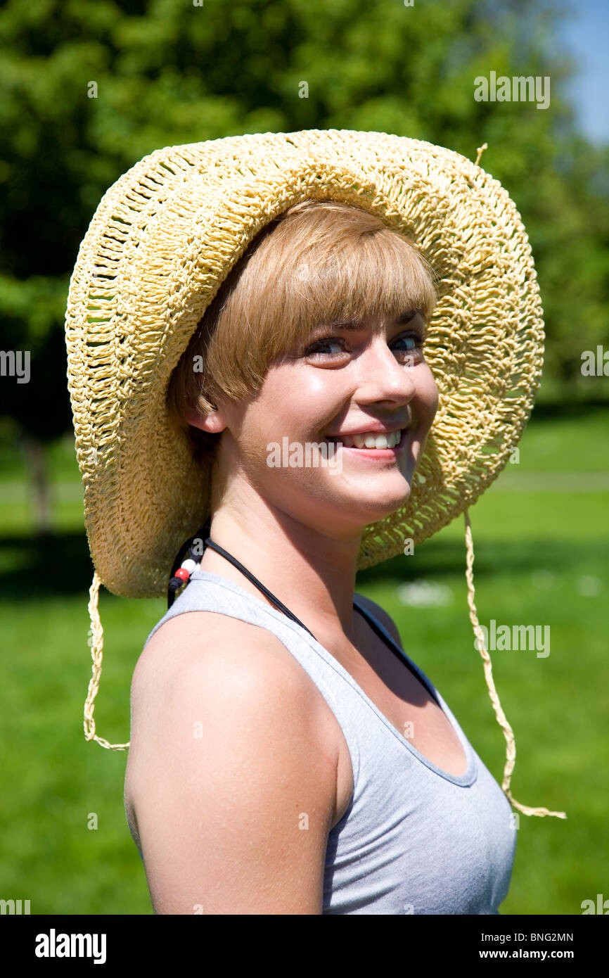Portrait of girl with straw hat smiling Stock Photo - Alamy