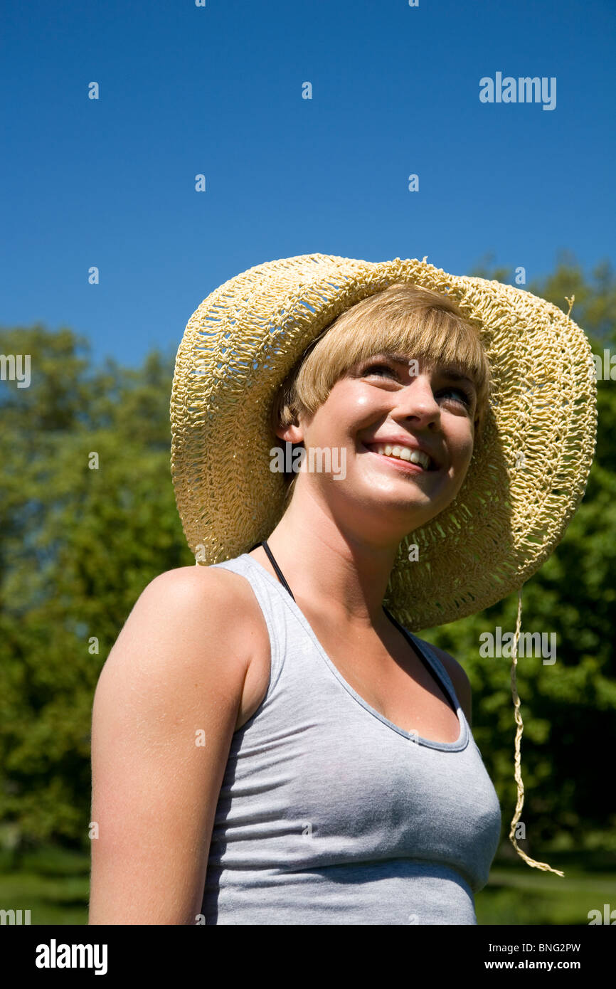 Portrait of girl with straw hat smiling Stock Photo Alamy