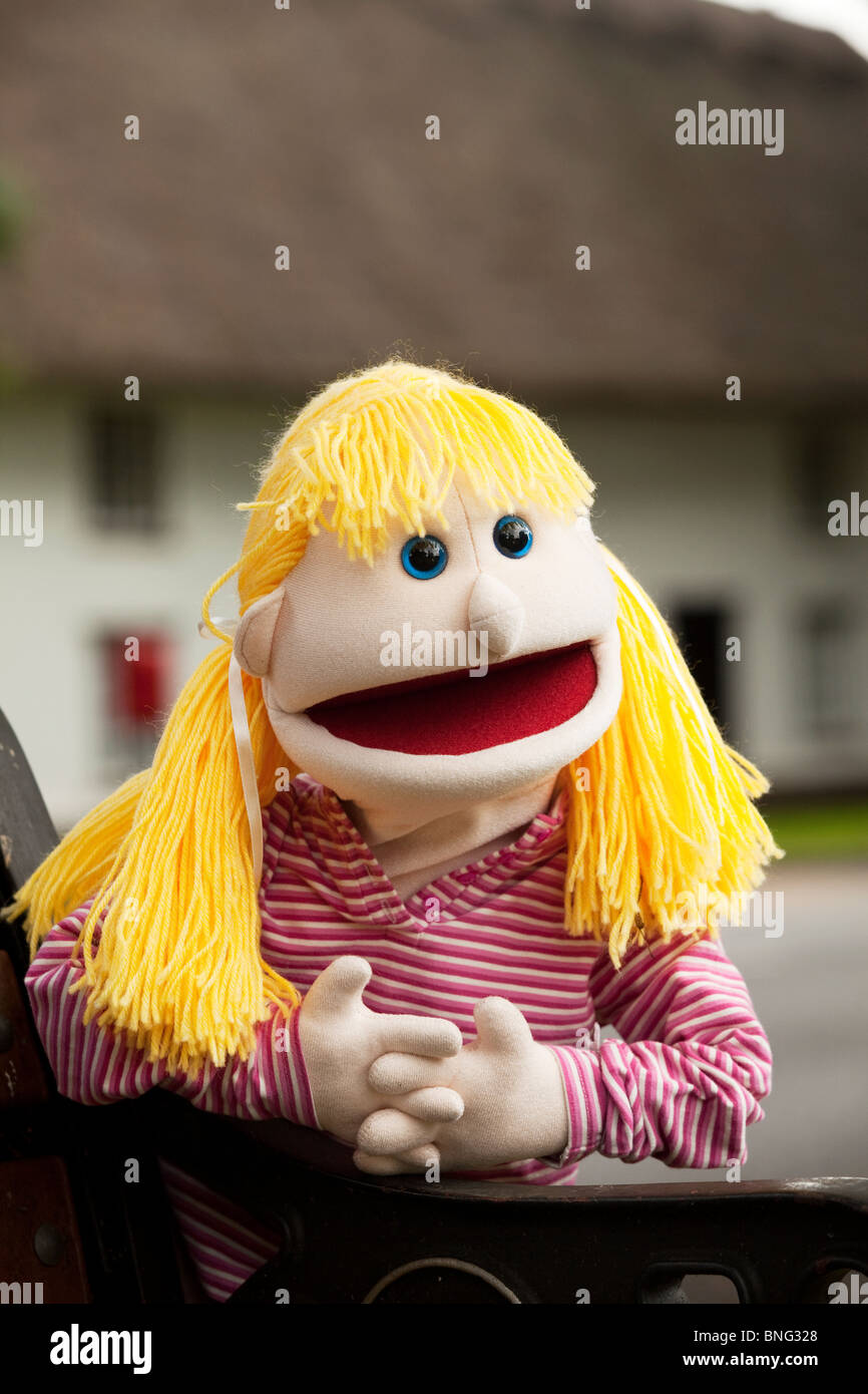Blond pony tailed amusing puppet with mouth open Stock Photo - Alamy