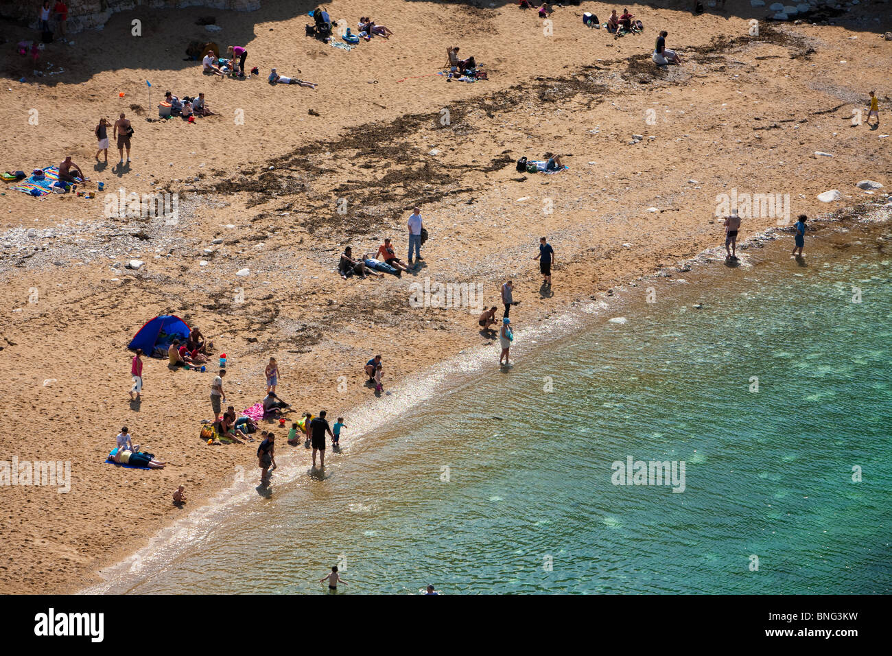 sun-bathers-on-the-beach-on-the-north-landing-at-flamborough-head-stock