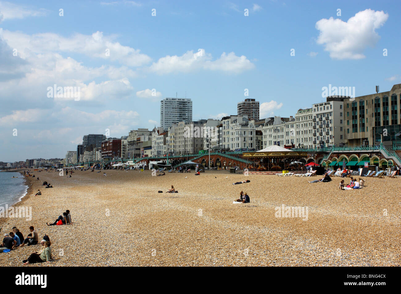 Brighton Beach from the pier looking West. Class hotels on the seafront overlooking the sea and the golden sands of Brighton. Stock Photo
