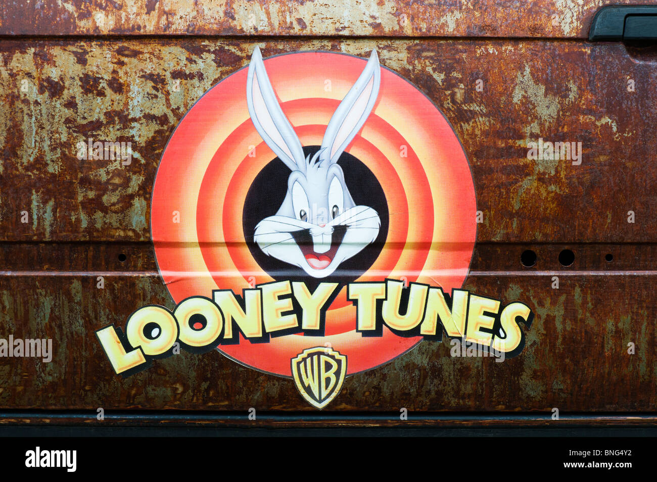 Looney tunes sticker on a rusty rat car door at the Santa Pod Retro show 2010 Stock Photo