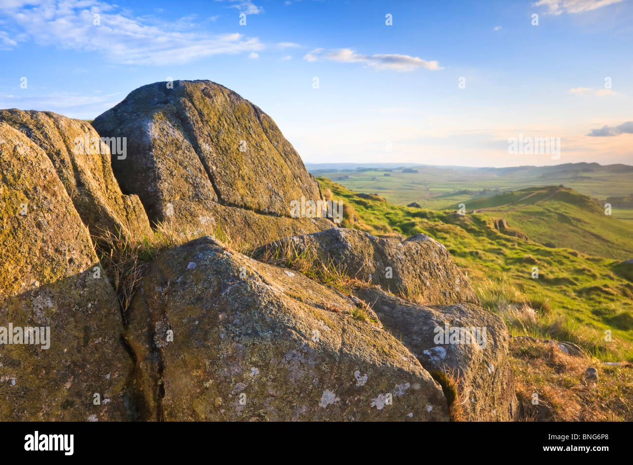 Dolerite rocks of the Whin Sill formation erupting from the landscape of Caw Gap on Hadrian's Wall, Northumberland, England Stock Photo