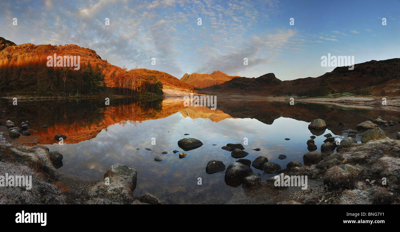 Dawn reflections, Blea Tarn. Langdale Pikes and Side Pike reflected in Blea Tarn in the English Lake District Stock Photo