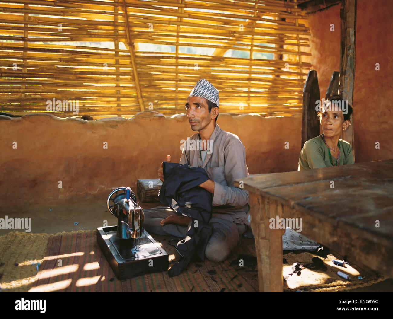 The village tailor and his wife in the village of Sultibari in east Nepal Stock Photo