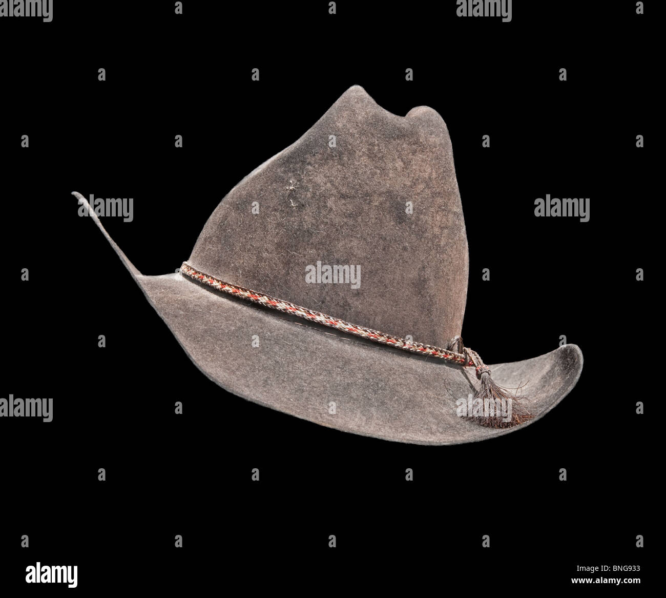 Old black cowboy hat against black background Stock Photo