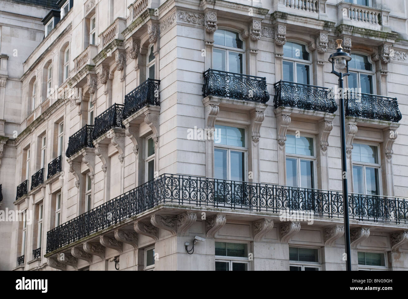 Corner house on Buckingham Palace Road with cast iron balconies, London, UK Stock Photo