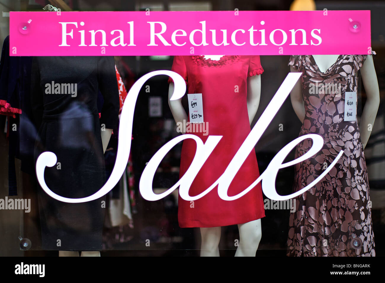 Final Reduction sale promotional material in High Street fashion shop Stock Photo