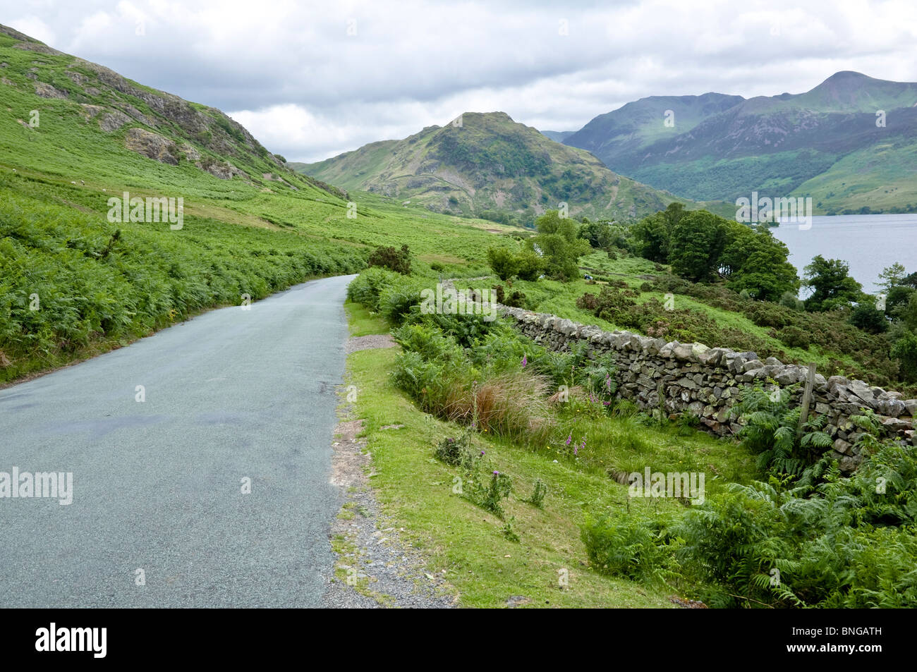 Scenic road running alongside Crummock Water towards Buttermere, The Lake District, Cumbria, UK Stock Photo