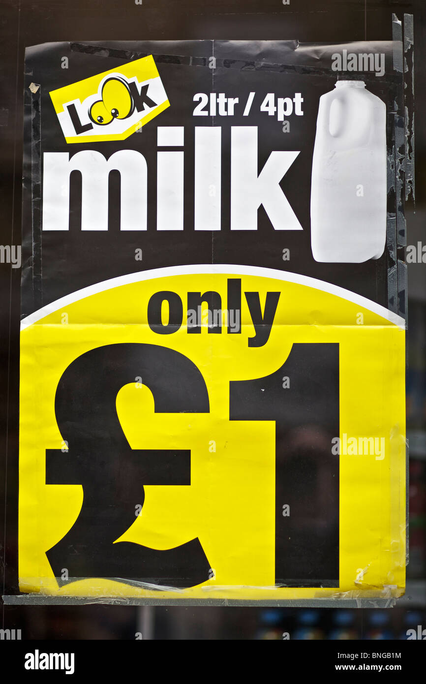 poster advertising cut price milk in shop window in Scotland, UK Stock Photo