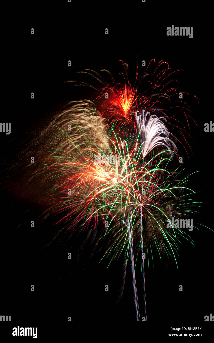 Fireworks exploding in night sky, pyrotechnics Stock Photo Alamy
