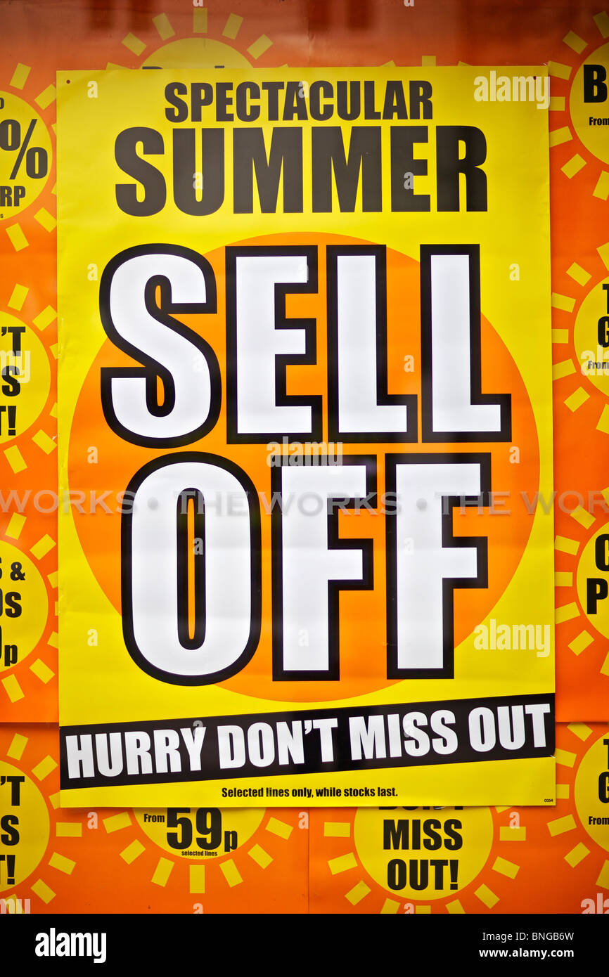 Summer sale poster in shop window on High Street Stock Photo