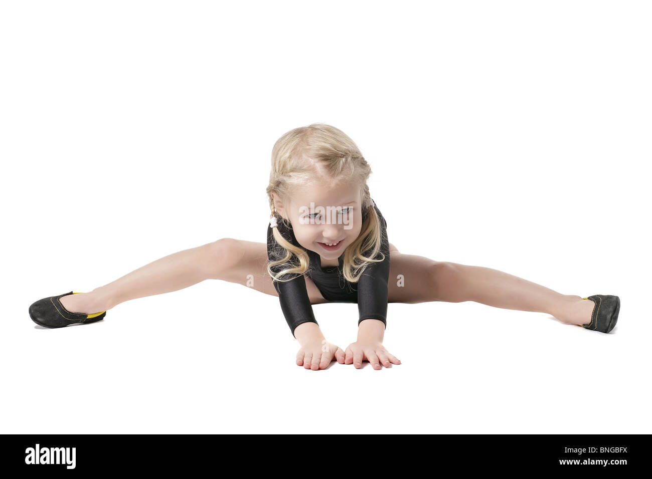 little girl in bodysuit for rhythmic gymnastics trying to do the splits