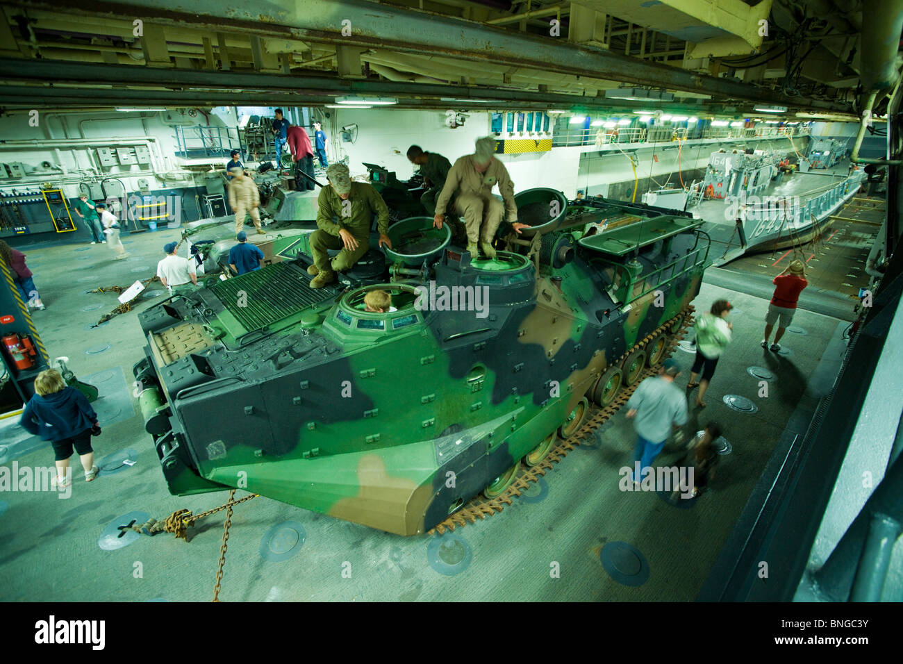 A tracked amphibious armored personnel carrier in the well deck of the US Navy amphibious assault ship USS WASP. Stock Photo