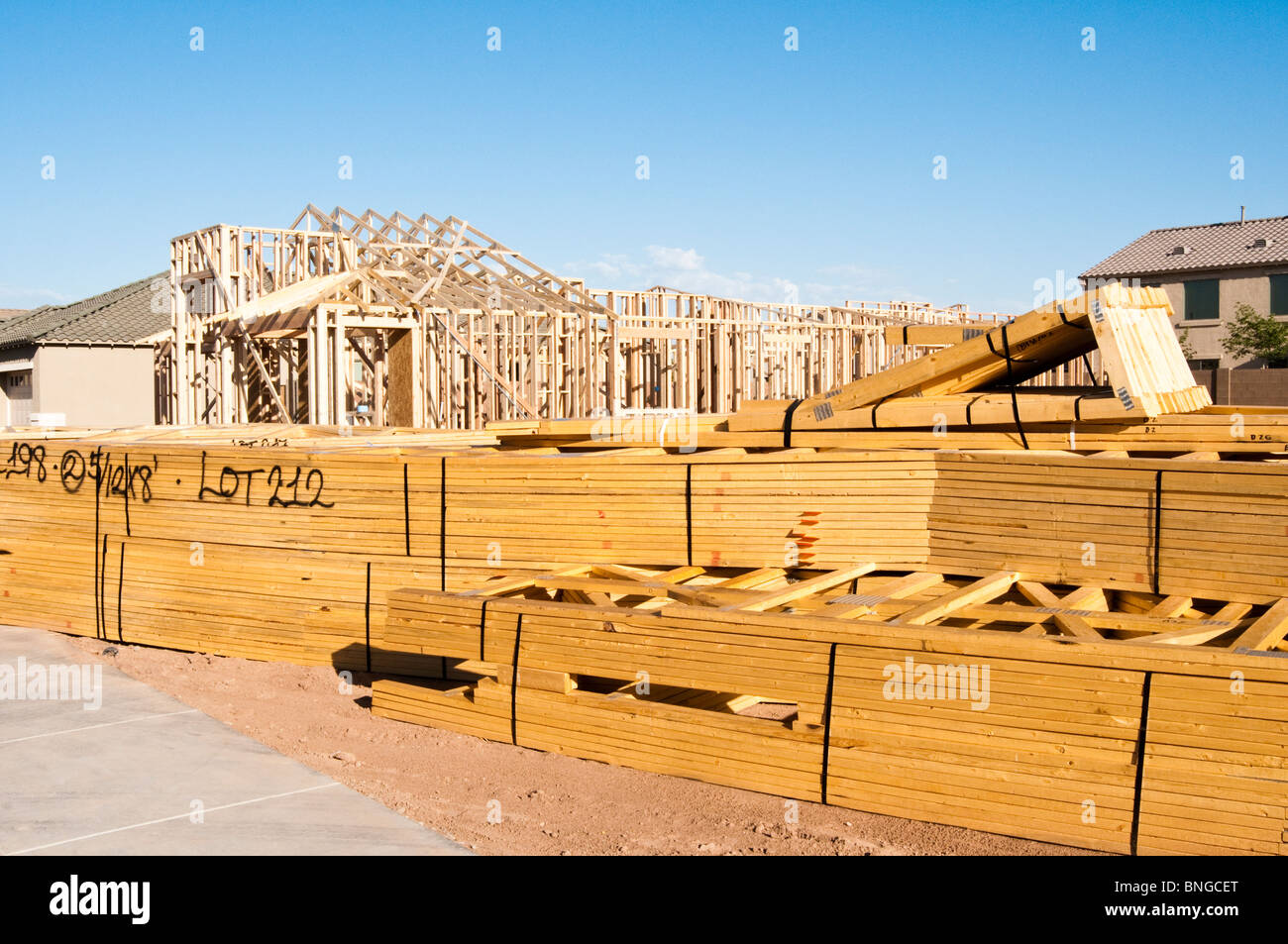 Building materials are stacked on the construction site for a new wood