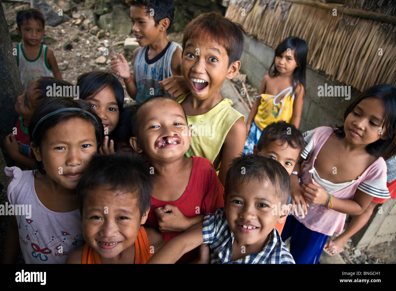 Smiling Filipino children in a small fishing village north of EL NIDO - PALAWAN ISLAND, PHILIPPINES Stock Photo